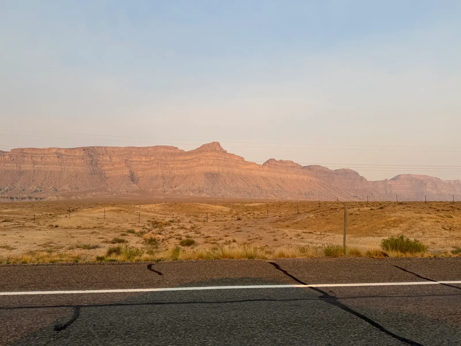 The Book Cliffs seen from the highway near Green River, Utah, hazy with wildfire smoke