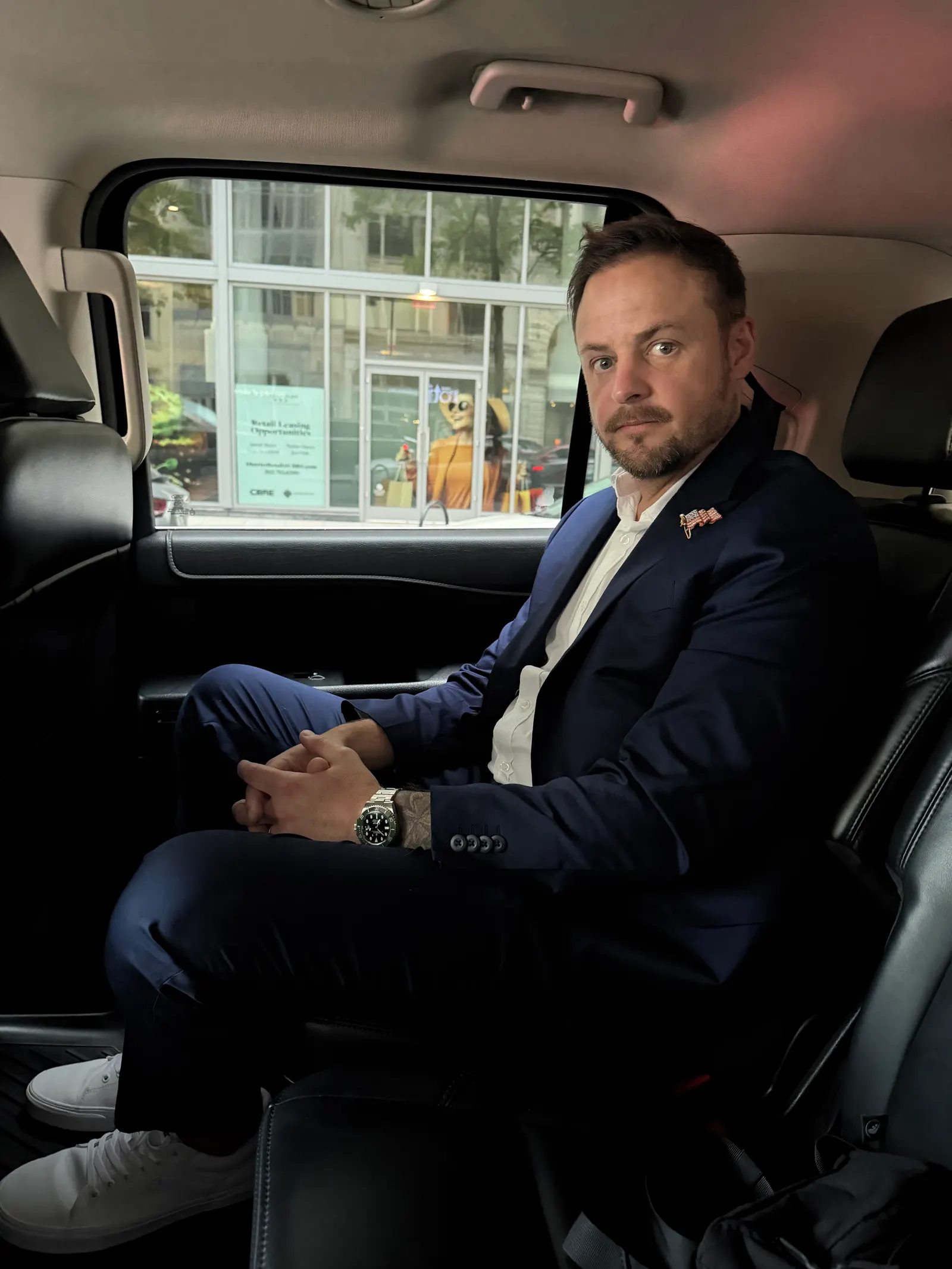 Brison McPhail in a suit riding to the National Mall on July 4, 2026