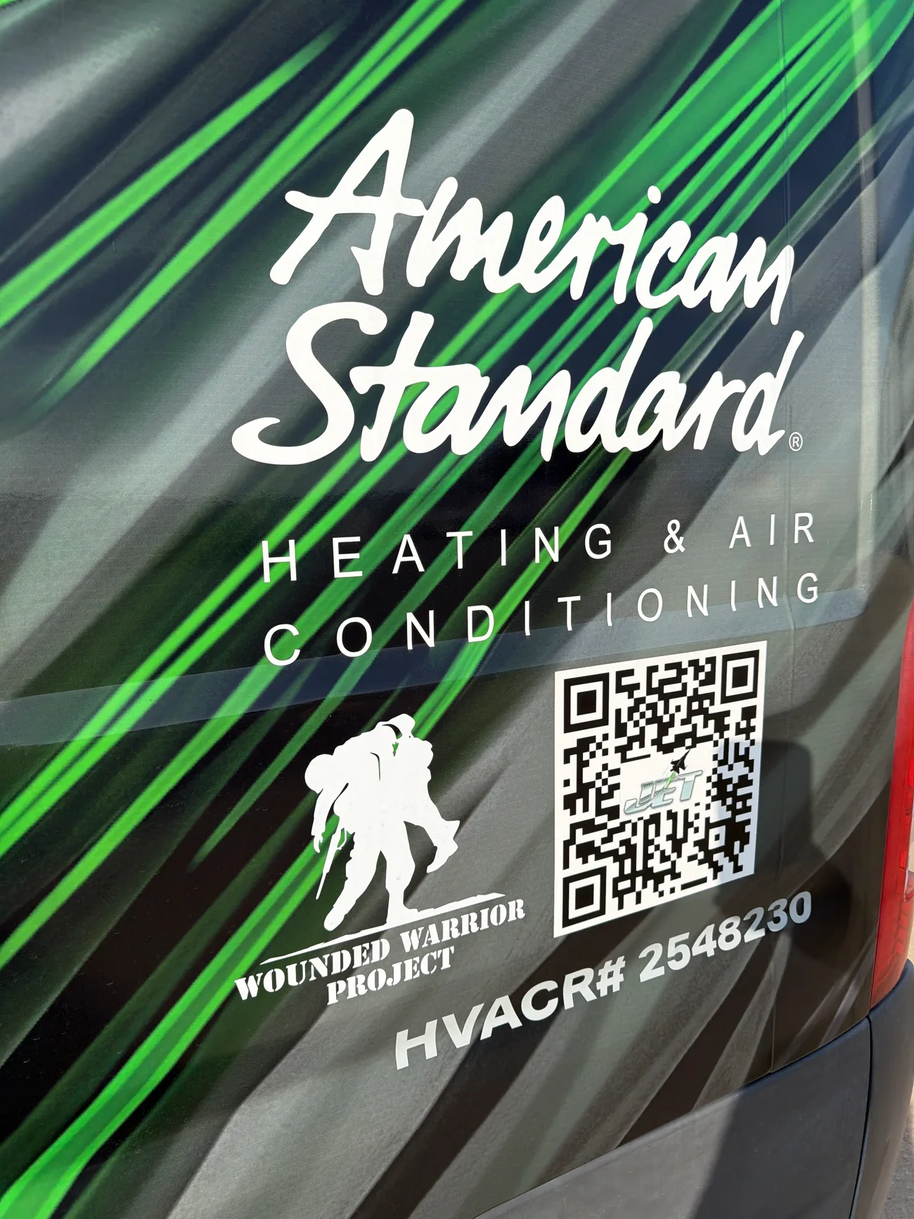 Jet Heat and Air truck wrap showing the Wounded Warrior Project logo alongside American Standard