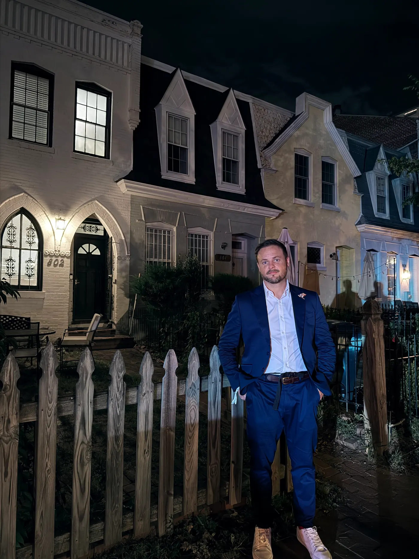 Brison McPhail, owner of Jet Heat and Air and editor of The Jet Journal, standing by historic rowhouses in Washington, D.C.