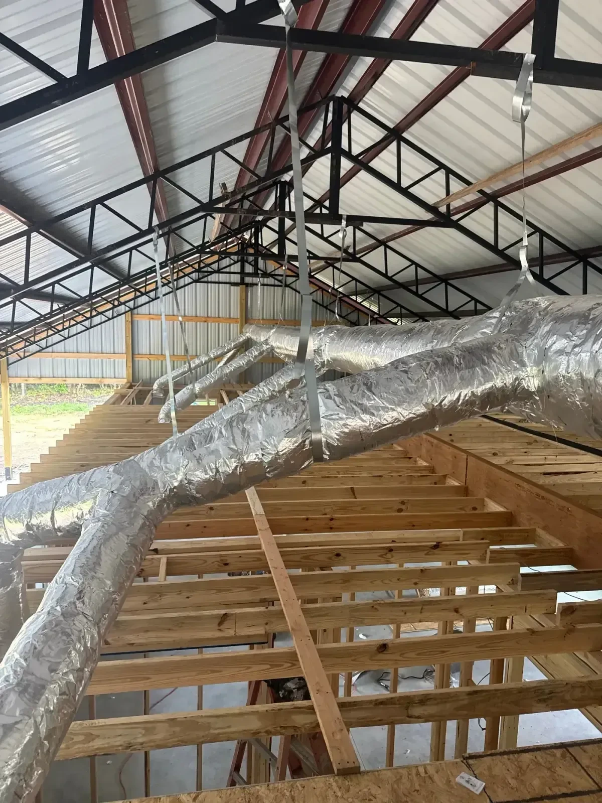 Insulated duct trunk and branch lines installed by Jet Heat and Air in a new-construction metal building, West Little Rock, Arkansas