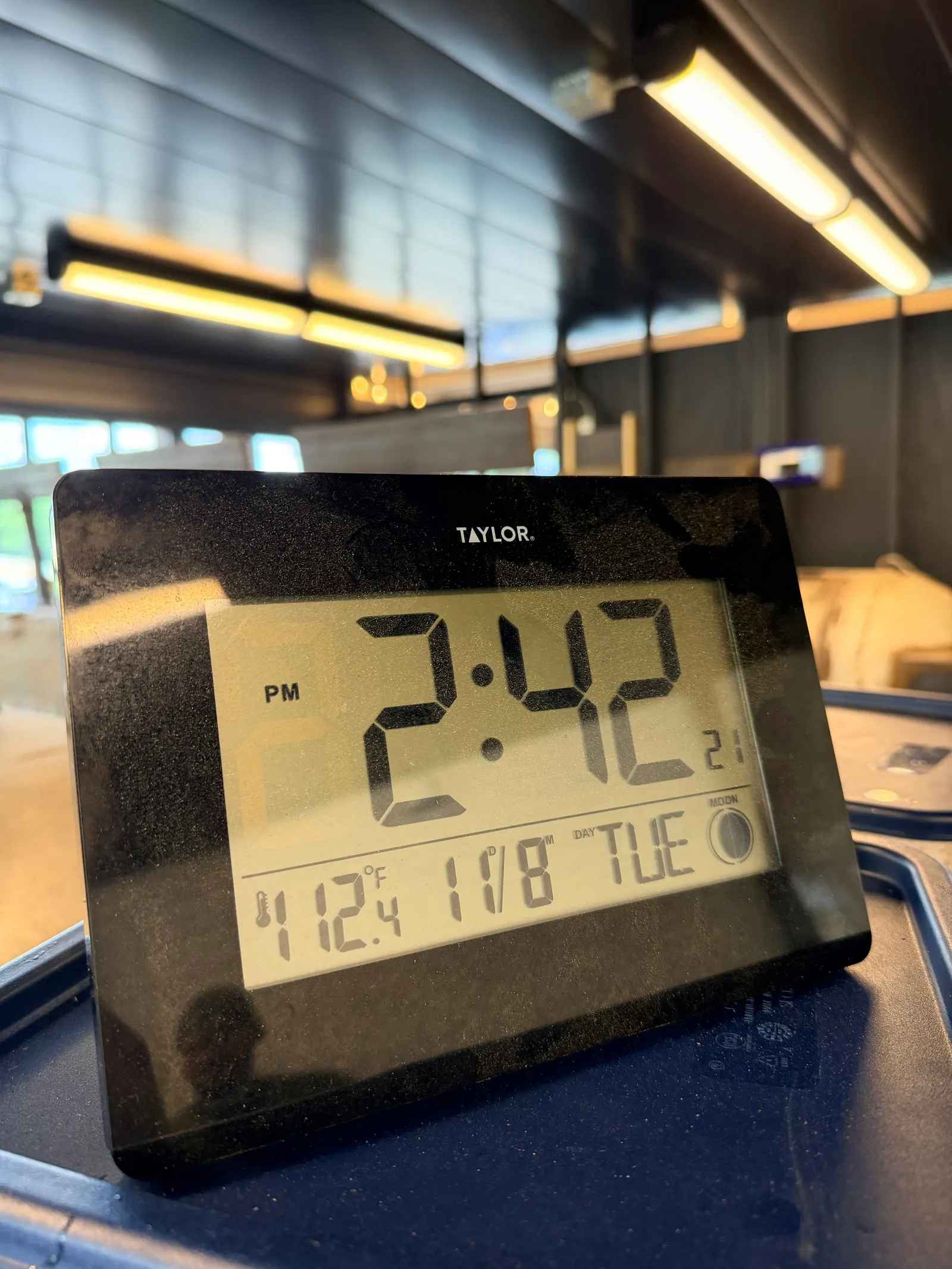 A wall thermometer in the Wright's Barbecue pit room reading 112.4 degrees Fahrenheit